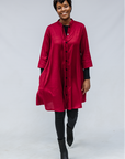 Model wearing burgundy linen dress.