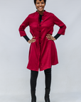 Model wearing burgundy linen dress.