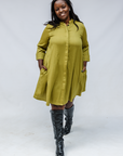 Model wearing olive green linen dress.