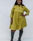 Model wearing olive green linen dress.