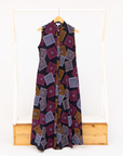 Display of pink, orange, white and black geometric print dress.
