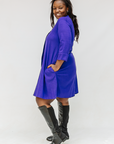 Model wearing deep blue linen dress.