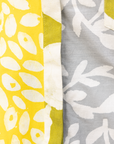 Close up display of mutlicolored batik shortsleeved shirt, fabric.