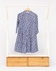 Display of blue and white swirl print dress.
