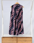 Display of black and pink sleeveless print dress.