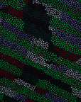 Close up display of green camo print like dress, fabric.