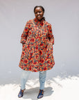 Model wearing butterfly print dress.