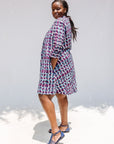 Model wearing purple and blue batik dress.