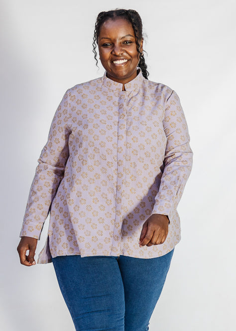 Model wearing linen top with small flower print.