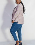 Model wearing linen top with small flower print.