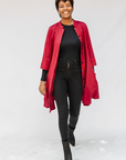Model wearing burgundy linen dress.