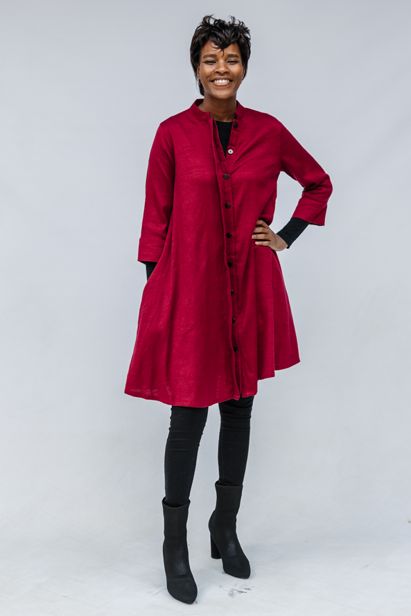 Model wearing burgundy linen dress.
