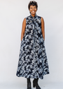 Model wearing navy and gray abstract print maxi dress.