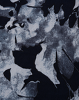 Close up display of navy and gray abstract print maxi dress.