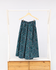 Display of aqua, black and white culottes.