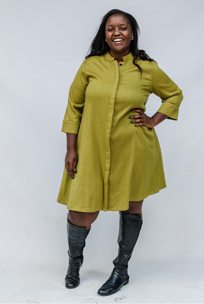 Model wearing olive green linen dress.