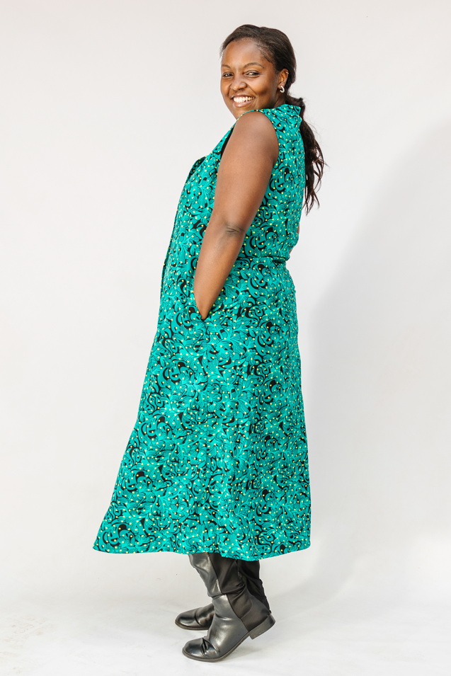 Model wearing teal floral maxi dress.