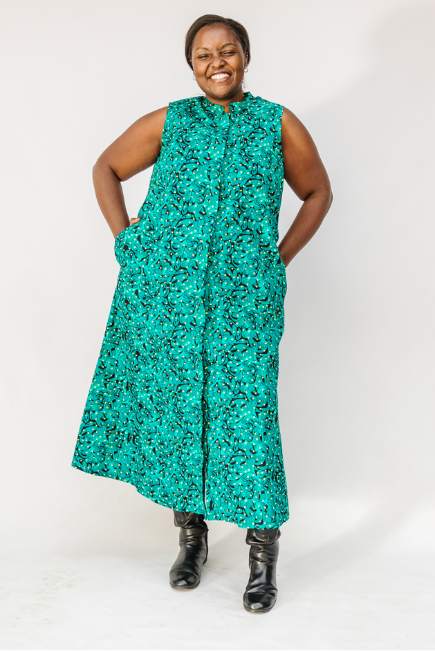 Model wearing teal floral maxi dress.