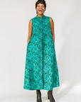 Model wearing teal floral maxi dress.