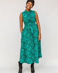 Model wearing teal floral maxi dress.