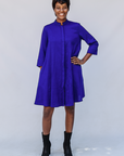 Model wearing deep blue linen dress.