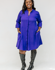 Model wearing deep blue linen dress.