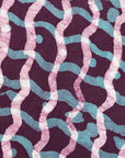 Close up display of purple and blue batik dress, fabric.