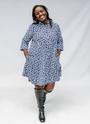 Model wearing blue and white swirl print dress.