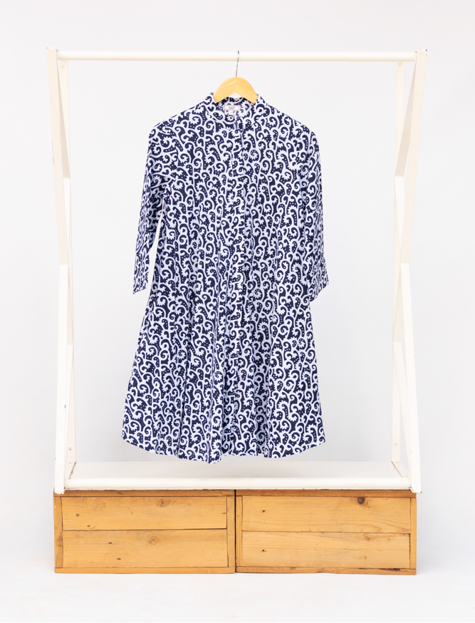 Display of blue and white swirl print dress.