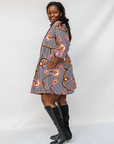 Model wearing black and white light bulb print dress.