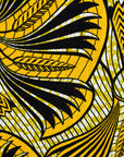 Close up of yellow and black sleeveless maxi dress.