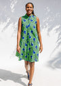 Model wearing sleeveless dress with green and blue snail print.
