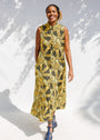 Model wearing yellow and black sleeveless maxi dress.