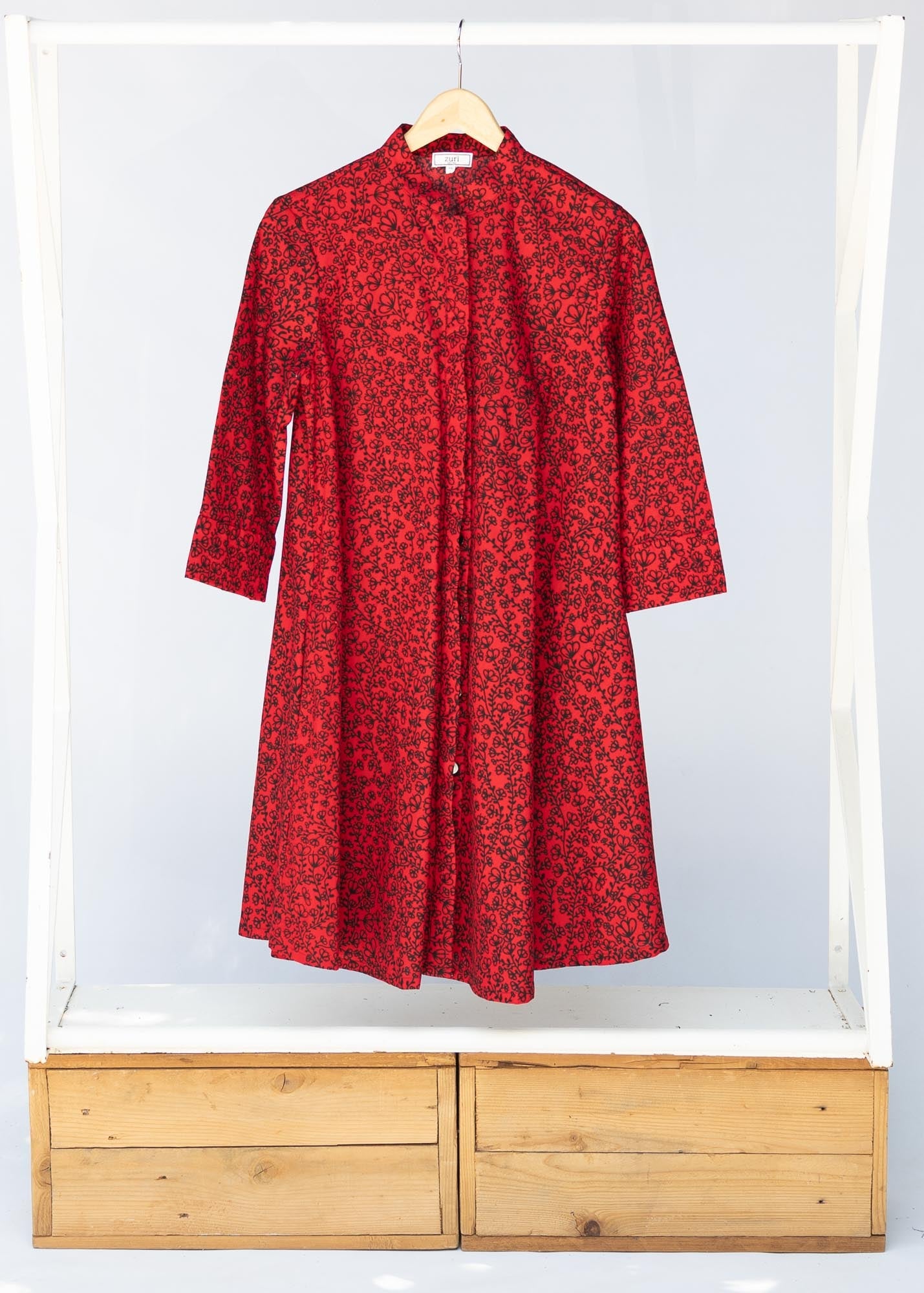 A red and black leaf design dress