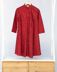 A red and black leaf design dress