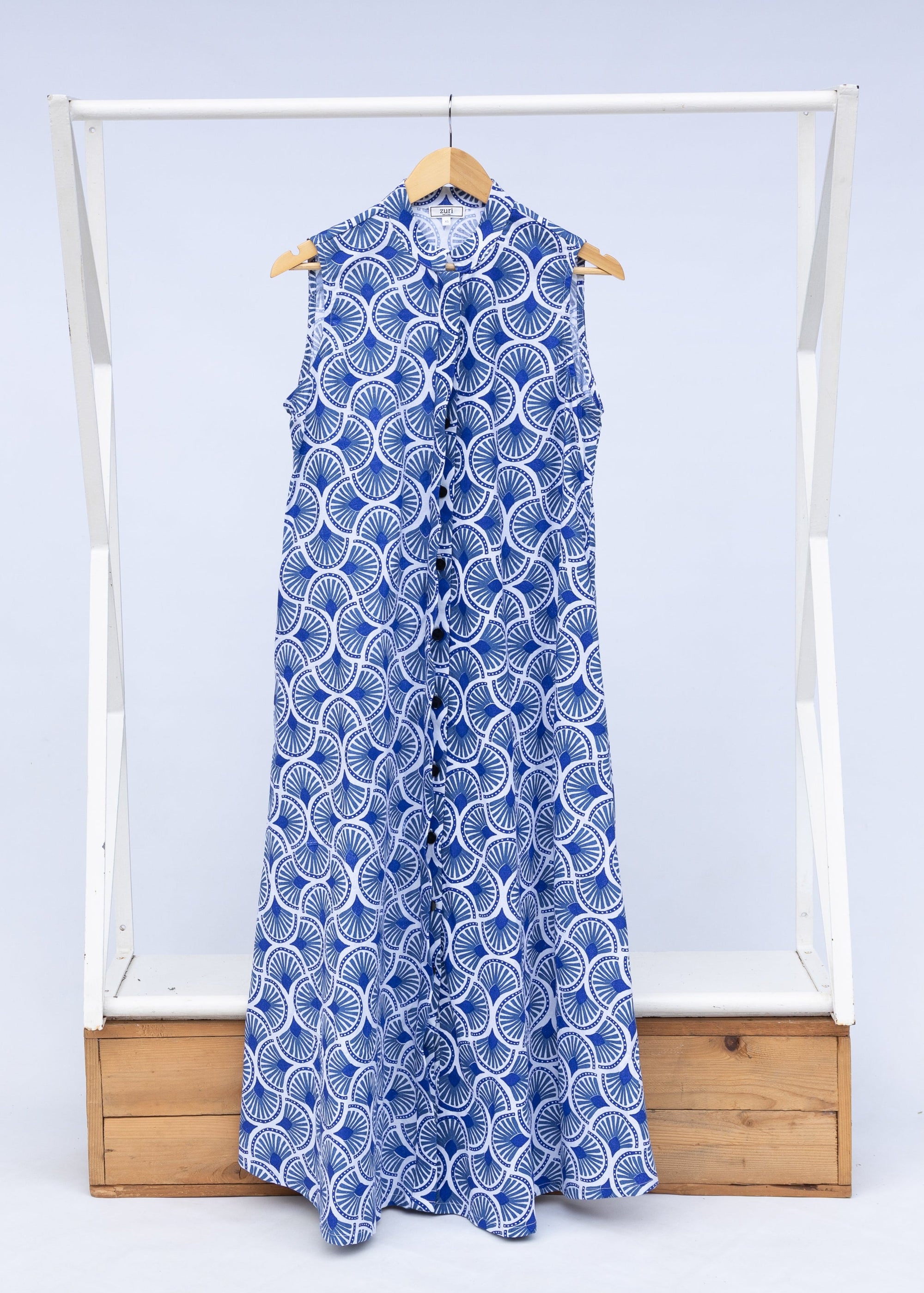 Display of blue and white mosaic print dress.