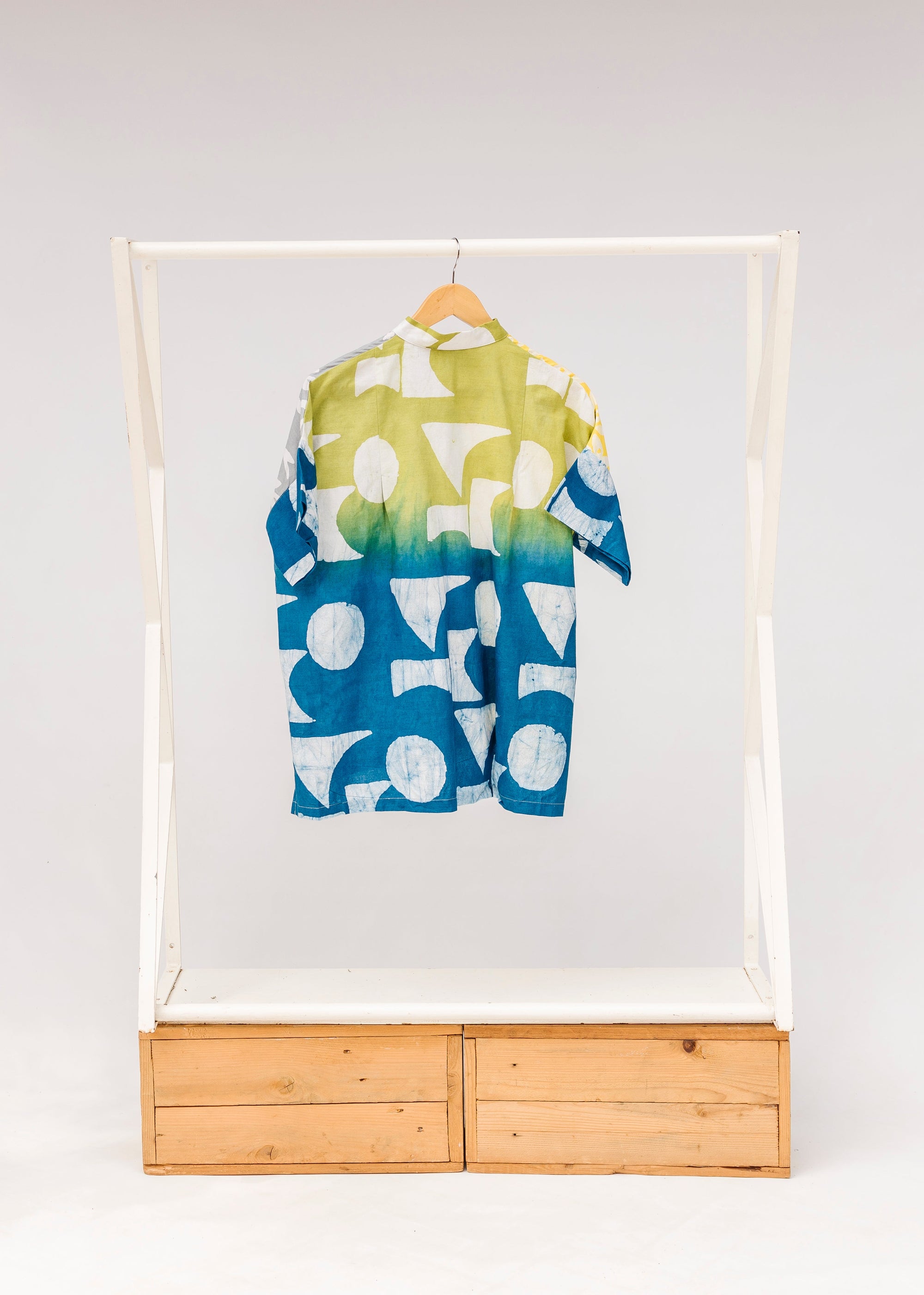 Display of mutlicolored batik shortsleeved shirt.