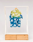 Display of mutlicolored batik shortsleeved shirt.