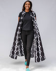 Model wearing black and white geometric print dress.