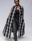 Model wearing black and white geometric print dress.