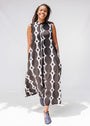 Model wearing black and white geometric print dress.
