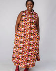 Model wearing geometric print dress.