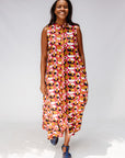 Model wearing geometric print dress.
