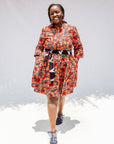 Model wearing butterfly print dress.